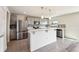 Bright kitchen features stainless steel appliances, pendant lighting and a breakfast bar at 11434 Wishing Well Ln, Clermont, FL 34711