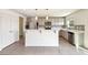 Modern kitchen featuring gray cabinets, stainless steel appliances, and tile backsplash at 11434 Wishing Well Ln, Clermont, FL 34711