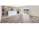 Open-concept kitchen featuring a breakfast bar and sliding glass doors to a deck at 11434 Wishing Well Ln, Clermont, FL 34711