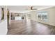 Open living space leads to a modern kitchen and boasts beautiful backyard views at 11434 Wishing Well Ln, Clermont, FL 34711