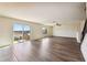 Open living room with luxury vinyl floors, ceiling fan, and sliding doors to outdoor deck at 11434 Wishing Well Ln, Clermont, FL 34711