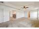 Loft with carpeted floors, ceiling fan, and access to multiple rooms and staircase at 11434 Wishing Well Ln, Clermont, FL 34711