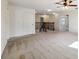 Loft with carpeted floors, ceiling fan, and access to multiple rooms at 11434 Wishing Well Ln, Clermont, FL 34711
