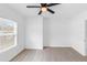 Bright bedroom with wood-look flooring and a large window at 1211 Dorothy St, Lakeland, FL 33815
