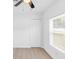 Neutral bedroom offers wood-look flooring, a ceiling fan and closet at 1211 Dorothy St, Lakeland, FL 33815