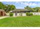 Charming home with well-maintained lawn and partially screened front porch at 1211 Dorothy St, Lakeland, FL 33815