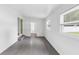 Enclosed porch has tile flooring and lots of natural light at 1211 Dorothy St, Lakeland, FL 33815