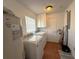 Laundry room with washer, dryer, and extra storage at 1255 N Highland St, Mount Dora, FL 32757