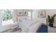 Bright bedroom with white dresser, bed, and window views at 1270 3Rd W St, Orange City, FL 32763