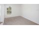 Simple bedroom with a window and carpet at 1270 3Rd W St, Orange City, FL 32763