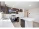 Modern kitchen with dark cabinets and island at 1270 3Rd W St, Orange City, FL 32763