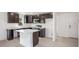 Modern kitchen with dark cabinets and island at 1270 3Rd W St, Orange City, FL 32763