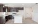 Modern kitchen with dark cabinets and island at 1270 3Rd W St, Orange City, FL 32763