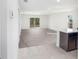 Spacious living room with grey carpet and access to patio at 1270 3Rd W St, Orange City, FL 32763