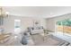 Spacious living area with large windows and sofa seating at 1270 3Rd W St, Orange City, FL 32763