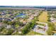 The aerial view shows the home's location in a mature neighborhood with a lake and green spaces at 12918 Hunters Vista Blvd, Orlando, FL 32837
