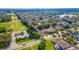 Expansive aerial view of a residential neighborhood with lush greenery and a nearby lake at 12918 Hunters Vista Blvd, Orlando, FL 32837