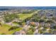 Wide aerial shot of a single Gathering neighborhood with mature landscaping and nearby green space and local amenities at 12918 Hunters Vista Blvd, Orlando, FL 32837