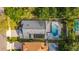 Aerial view of the home and surrounding area, featuring a private screened in pool in a beautiful outdoor area at 12918 Hunters Vista Blvd, Orlando, FL 32837