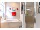 Bright bathroom featuring a soaking tub under a window and a separate glass shower at 12918 Hunters Vista Blvd, Orlando, FL 32837
