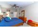 Cozy bedroom featuring a wicker headboard, ceiling fan, and dresser at 12918 Hunters Vista Blvd, Orlando, FL 32837