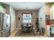 Charming dining area featuring a modern table set and view from the window at 12918 Hunters Vista Blvd, Orlando, FL 32837