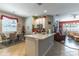 Open concept kitchen featuring white cabinetry and a cozy breakfast nook area at 12918 Hunters Vista Blvd, Orlando, FL 32837
