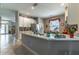 Bright kitchen featuring white cabinets, granite countertops and stainless steel faucet at 12918 Hunters Vista Blvd, Orlando, FL 32837