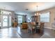 Open-concept living and dining room with plenty of natural light and modern finishes at 12918 Hunters Vista Blvd, Orlando, FL 32837