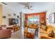 Inviting living room with hardwood floors, ample seating, and a view to the backyard at 12918 Hunters Vista Blvd, Orlando, FL 32837