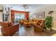 Cozy living room with hardwood floors, comfortable seating, and a bright, airy ambiance at 12918 Hunters Vista Blvd, Orlando, FL 32837