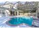 Back of home featuring a screened in private pool with a spacious deck, and outdoor seating under a covered patio at 12918 Hunters Vista Blvd, Orlando, FL 32837