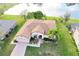 Aerial view of the house with a lake and a beautifully landscaped yard at 1332 Hunterman Lane, Winter Garden, FL 34787