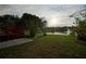Backyard with a view of a lake with a fountain at 1332 Hunterman Lane, Winter Garden, FL 34787