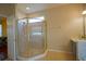 Bright bathroom features a glass shower with tile surround at 1332 Hunterman Lane, Winter Garden, FL 34787