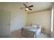 This cozy bedroom offers ample closet space and a relaxing atmosphere at 1332 Hunterman Lane, Winter Garden, FL 34787