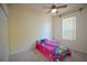 Bright bedroom features a ceiling fan, neutral walls, and carpeted flooring at 1332 Hunterman Lane, Winter Garden, FL 34787