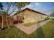 Beautiful backyard view with a brick sidewalk leading to the rear entrance at 1332 Hunterman Lane, Winter Garden, FL 34787
