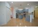 Well-lit kitchen with blue cabinetry, stainless steel appliances, and tiled flooring and backsplash at 1332 Hunterman Lane, Winter Garden, FL 34787