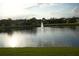 Scenic view of a tranquil lake with a fountain at 1332 Hunterman Lane, Winter Garden, FL 34787