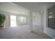 Spacious living area featuring natural light, neutral colors, and an airy atmosphere at 1332 Hunterman Lane, Winter Garden, FL 34787