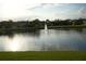 Scenic view of a serene pond with a fountain, offering a peaceful and picturesque setting at 1332 Hunterman Lane, Winter Garden, FL 34787