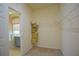 Walk-in closet with wire shelving with easy access to the bathroom at 1332 Hunterman Lane, Winter Garden, FL 34787
