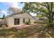 Private backyard with patio and mature landscaping at 14424 Quail Trail Ct, Orlando, FL 32837