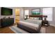 Main bedroom with a king-size bed and en-suite bathroom at 14424 Quail Trail Ct, Orlando, FL 32837