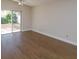 Bright bedroom with hardwood floors and sliding glass doors to backyard at 14424 Quail Trail Ct, Orlando, FL 32837