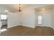 Elegant dining room with hardwood floors, chandelier, and kitchen view at 14424 Quail Trail Ct, Orlando, FL 32837