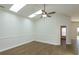 Spacious living room with hardwood floors, high ceilings and skylights at 14424 Quail Trail Ct, Orlando, FL 32837