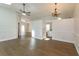 Open concept living room with hardwood floors, high ceilings and skylights at 14424 Quail Trail Ct, Orlando, FL 32837