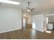 Bright living room with hardwood floors, ceiling fan and access to backyard at 14424 Quail Trail Ct, Orlando, FL 32837